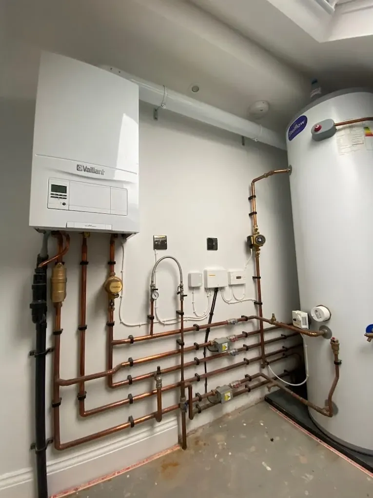 Vaillant system boiler and unvented cylinder with neat copper pipework and controls