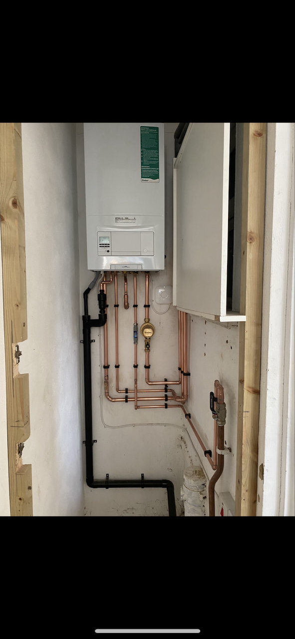 New Vaillant combi boiler with clean copper pipework, cylinder removed