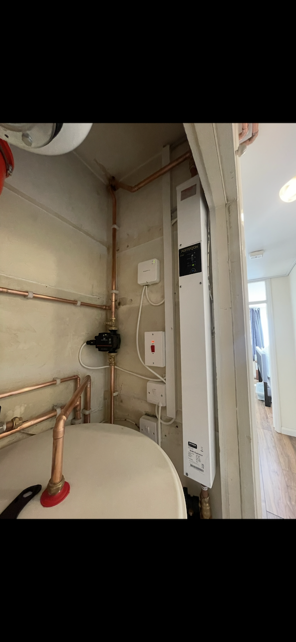 Potterton electric boiler mounted alongside unvented cylinder